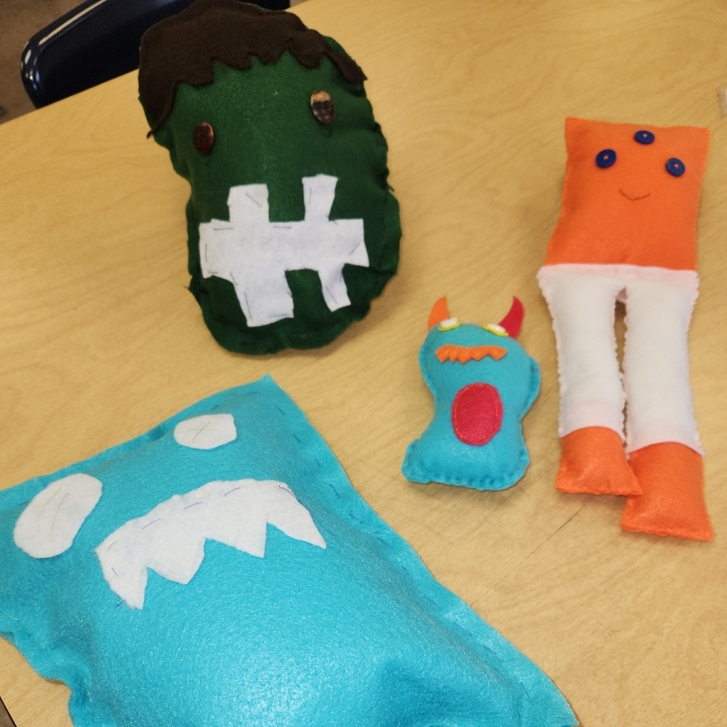 8th grade felt monster's using hand stitches learned in class